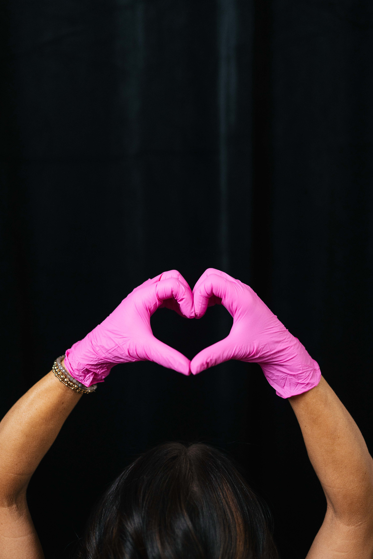 Pink Glove Experience — heart hands